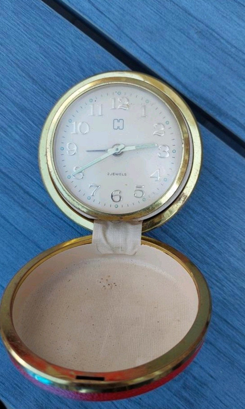 Antiek Reiswekker Klokje met Gouden Rand en Rode Buitenkant, Antiek en Kunst, Antiek | Klokken, Ophalen of Verzenden
