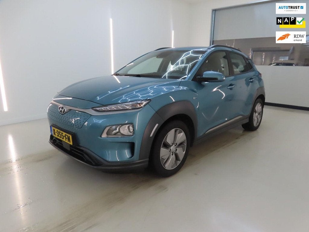 Hyundai Kona EV Comfort 64 kWh FASE 3|SOH 100%, Auto's, Dealer onderhouden, Stof, Gebruikt, Zwart