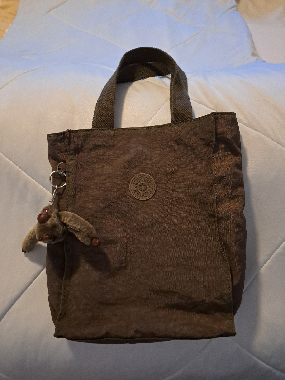 Bruin kipling tas , compleet met aap, Ophalen of Verzenden, Zo goed als nieuw, Bruin, Schoudertasje