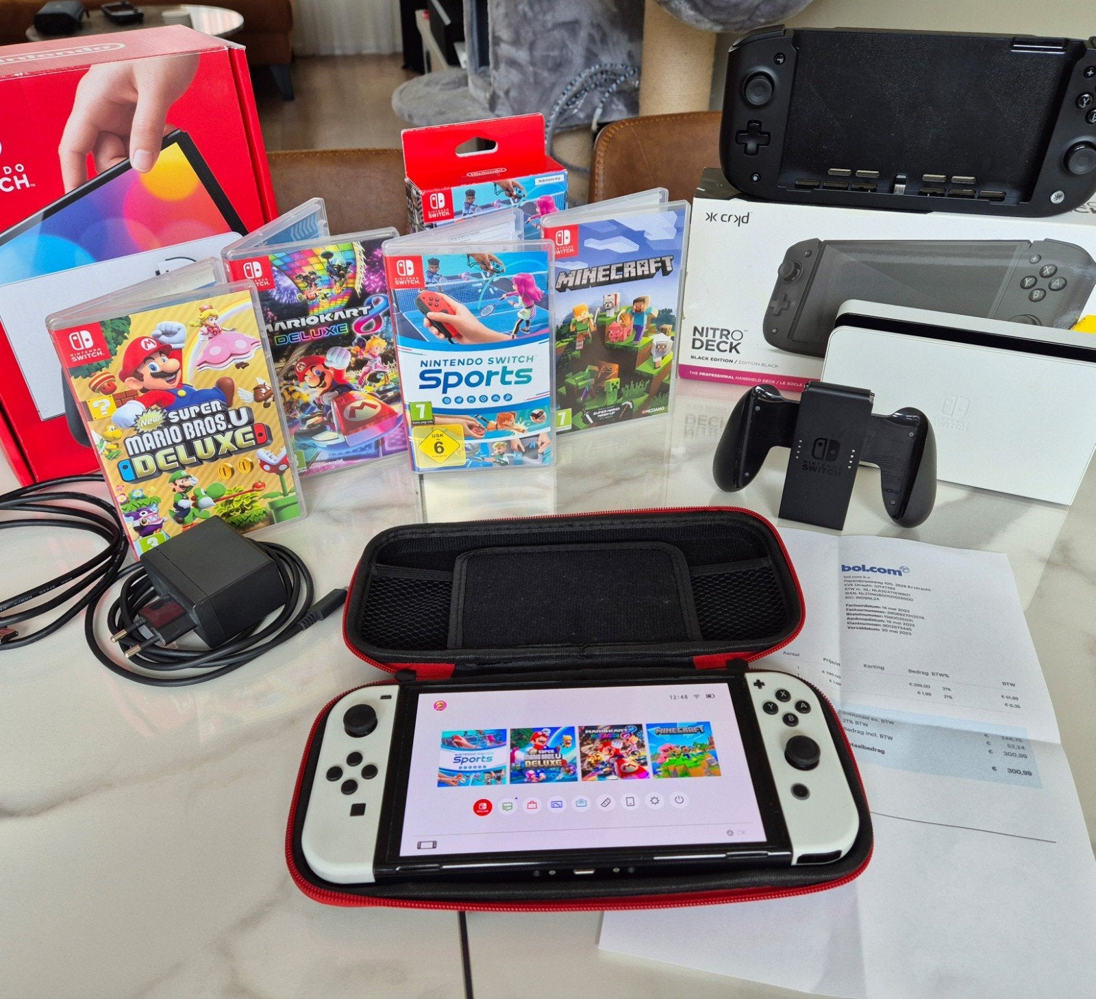 Nintendo Switch OLED – complete set + 4 games + Nitro Deck, Switch OLED, Met games, Ophalen of Verzenden, Zo goed als nieuw