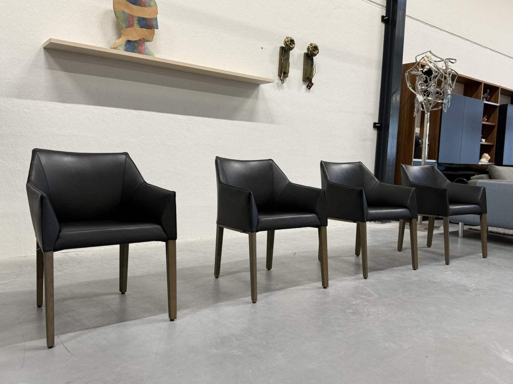 4 Leolux Pyrite eetkamerstoelen zwart leer design stoel hout