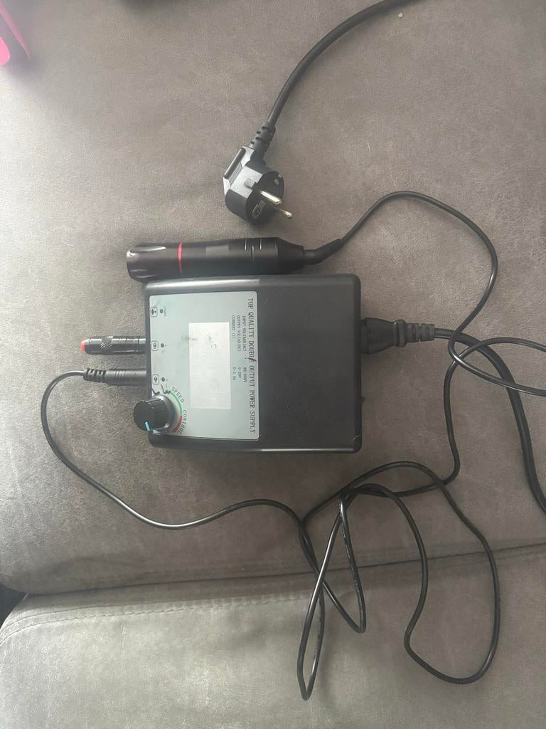 Tattoo gun met regelbare voeding, Ophalen