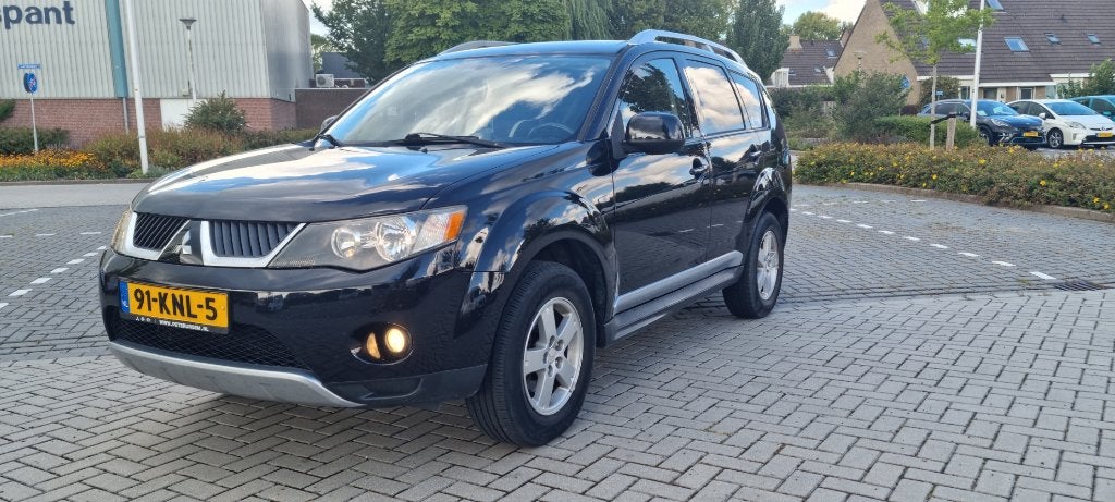 Mitsubishi Outlander 2.4 MPI 2WD 2010 Zwart, Auto's, Voorwielaandrijving, Outlander, Zwart, 4 cilinders