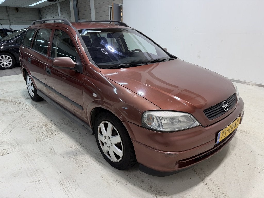 Opel Astra Wagon 1.6-16V Comfort (bj 2001), Auto's, Verwarmde buitenspiegels, 1598 cc, Rood, 5 stoelen