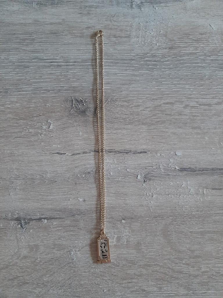 Goudkleurige ketting met Egyptische hanger en strass nieuw, Overige materialen, Gebruikt, Met strass, Ophalen of Verzenden