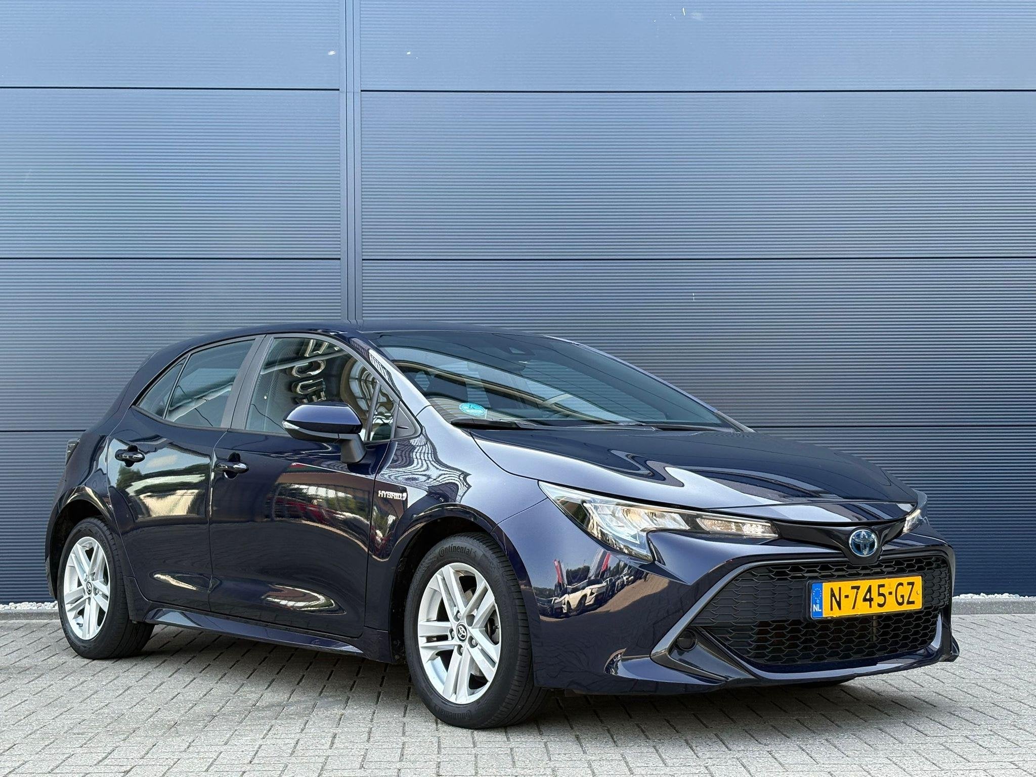 Toyota Corolla 1.8 Hybrid Active | Navigatie | Trekhaak | Cl, Auto's, Start-stop-systeem, Gebruikt, 4 cilinders, Blauw