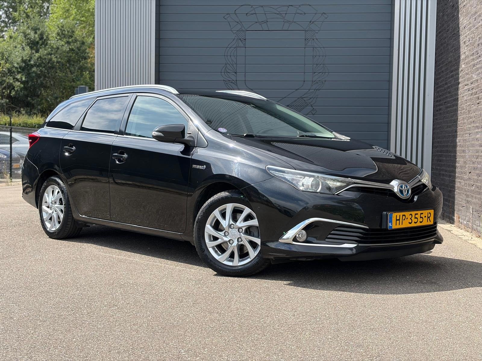 Toyota Auris Touring Sports 1.8 Hybrid Executive Half Leer|C, 28 km/l, Gebruikt, Leder en Stof, Zwart