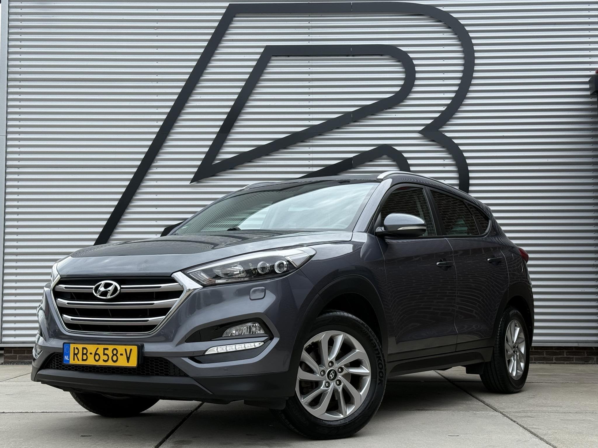 Hyundai Tucson 1.6 GDi Comfort 1e Eigenaar|Navi|Camera|Clima, Auto's, Voorwielaandrijving, Gebruikt, 4 cilinders, 132 pk