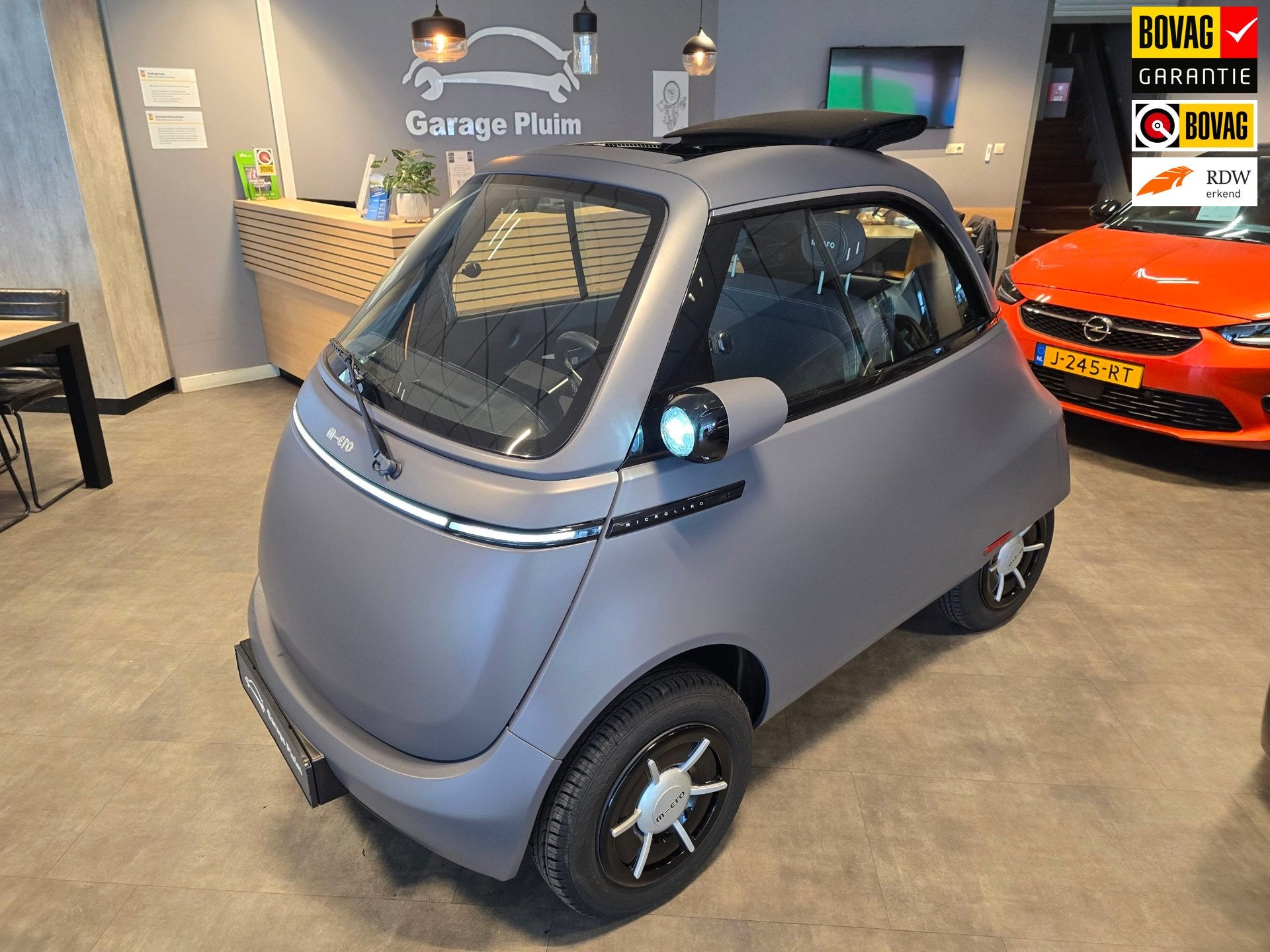 Micro Microlino Microlino Competizione 10.5 kWh 10.5 KWh L7, Auto's, Stof, Gebruikt, Zwart, Centrale vergrendeling