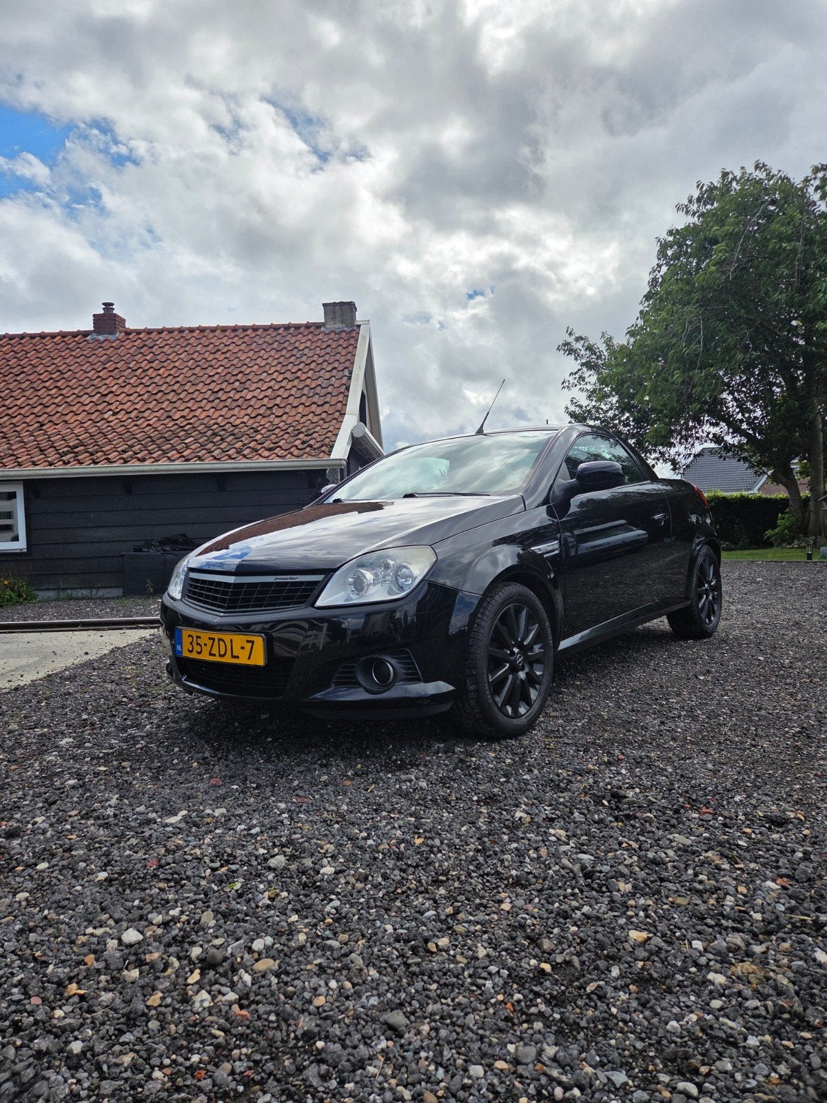 Opel Tigra 1.4 16V Twintop 2005 Zwart, Auto's, Voorwielaandrijving, 4 cilinders, Cabriolet, Leder en Stof