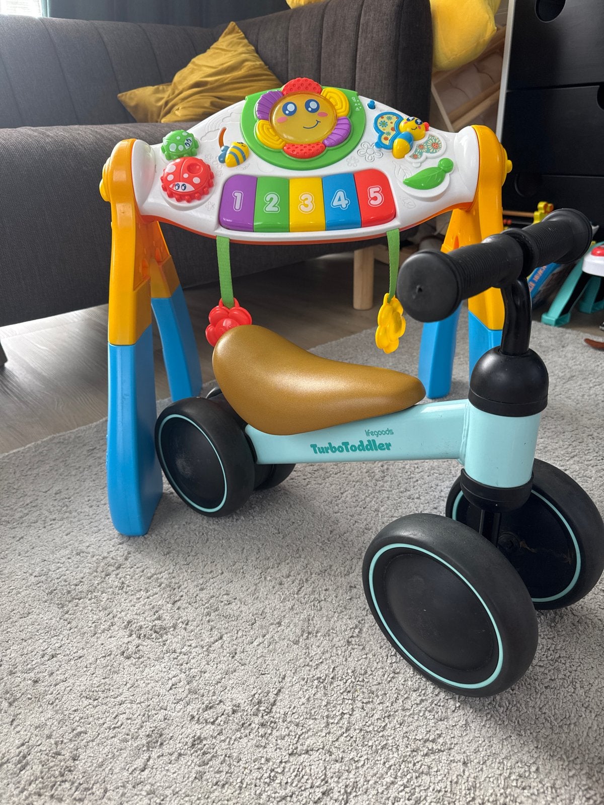 Baby speelgoed set: loopfiets, babygym en rammelaars
