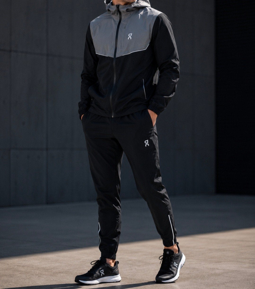 On Running hardloopjack en broek set - Zwart/Grijs, Kleding | Heren, Sportkleding, Zwart, Maat 56/58 (XL), Ophalen of Verzenden