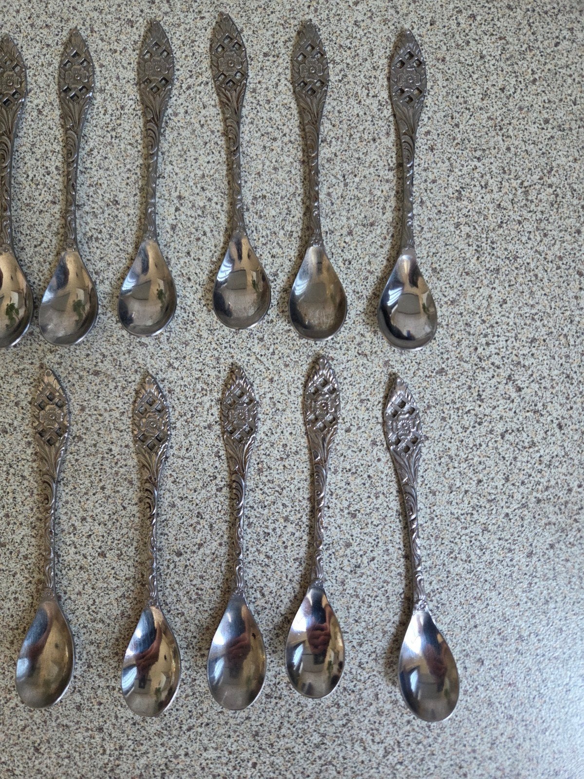 Set van 10 Pako Meta theelepels met decoratieve handvatten, Antiek en Kunst, Antiek | Bestek, Ophalen of Verzenden