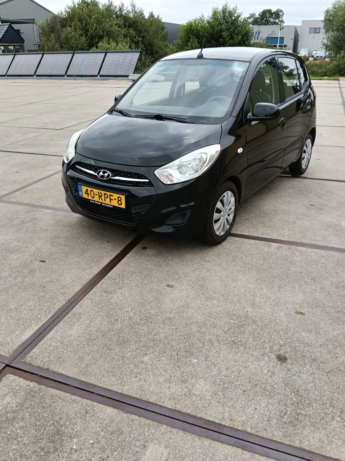 Hyundai i10 1.1 I 5DR 2011 Zwart, Auto's, Hyundai, Stof, 4 cilinders, 400 kg, Zwart