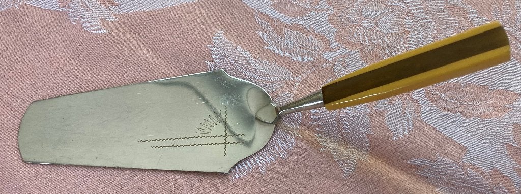 Taartschep met bruin geel handvat en inscriptie vintage, Ophalen of Verzenden