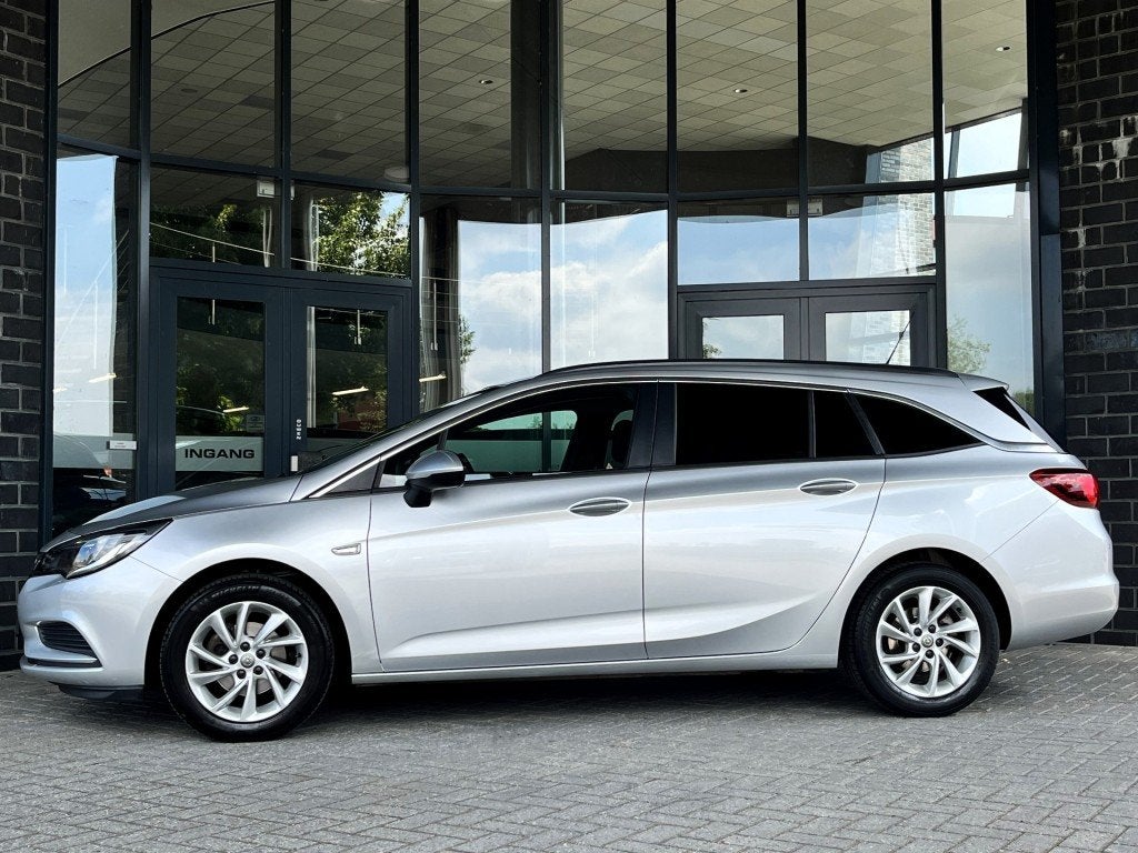 Opel ASTRA SPORTS TOURER 1.0 T. BUSINESS NAVI - CRUISE - TRE, Auto's, Gebruikt, Euro 6, 1178 kg, 620 kg