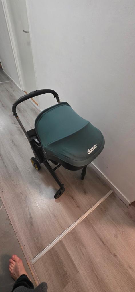 Doona autostoel en kinderwagen in één, Ophalen of Verzenden, Gebruikt, Overige merken, Zonnekap