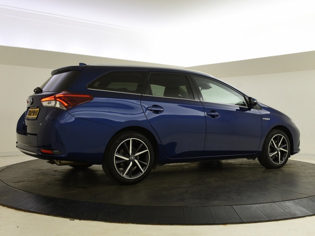 Toyota Auris Touring Sports 1.8 Hybrid Team D (bj 2018), Auto's, Automaat, Gebruikt, 4 cilinders, Blauw