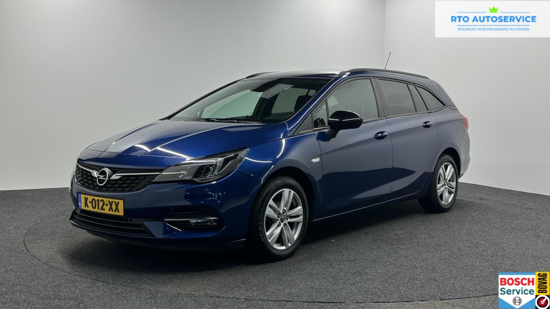 Opel Astra Sports Tourer 1.2 Business Edition TREKHAAK CRUIS, Auto's, Voorwielaandrijving, Stof, 1199 cc, Met garantie (alle)