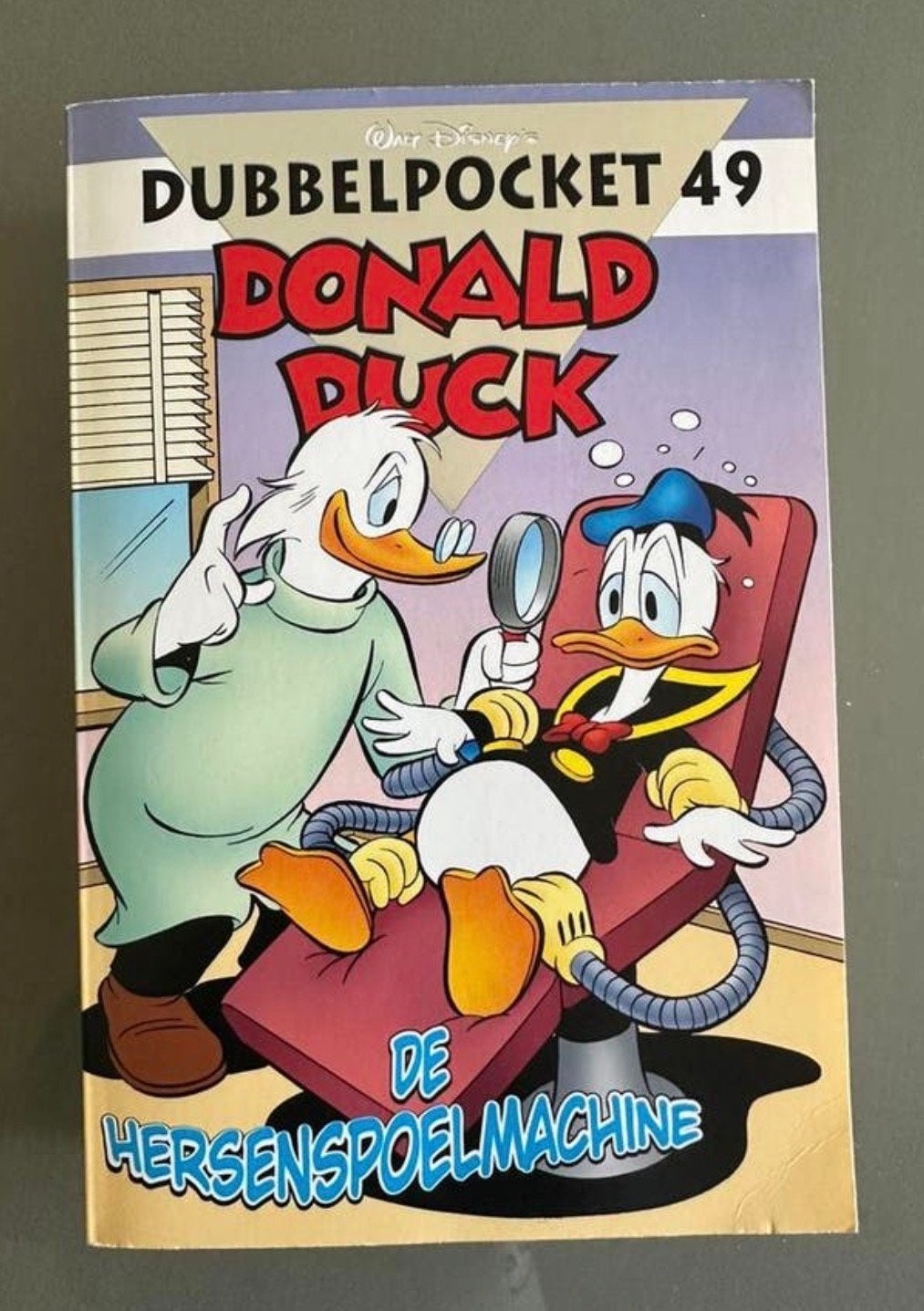 Donald Duck Dubbelpocket 49 - De Hersenspoelmachine (Z.G.A.N, Eén stripboek, Ophalen of Verzenden, Zo goed als nieuw