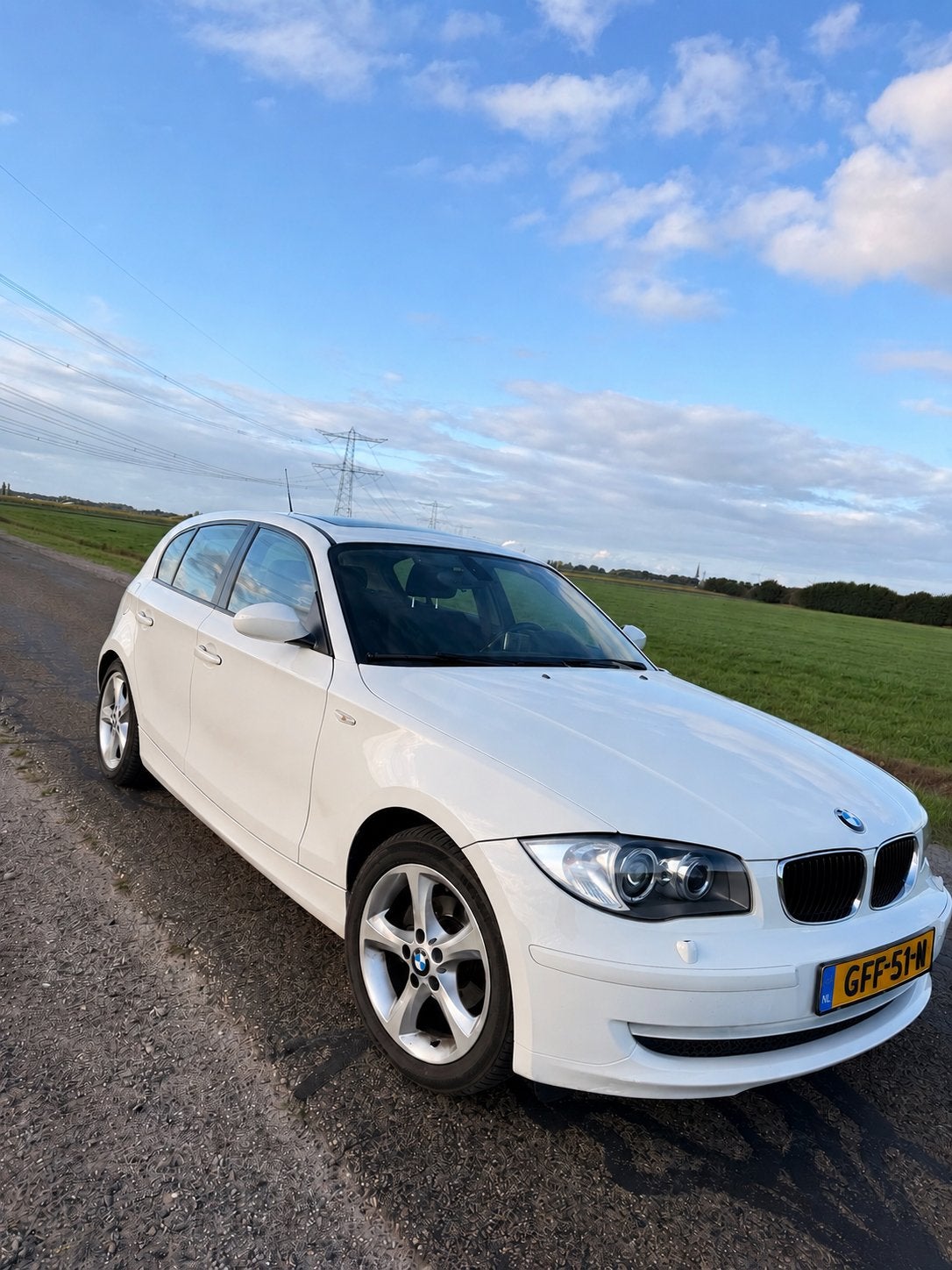 BMW 1-Serie 116i 122pk 5D Aut. 2009 Wit, Auto's, 1995 cc, 4 cilinders, 1200 kg, 650 kg