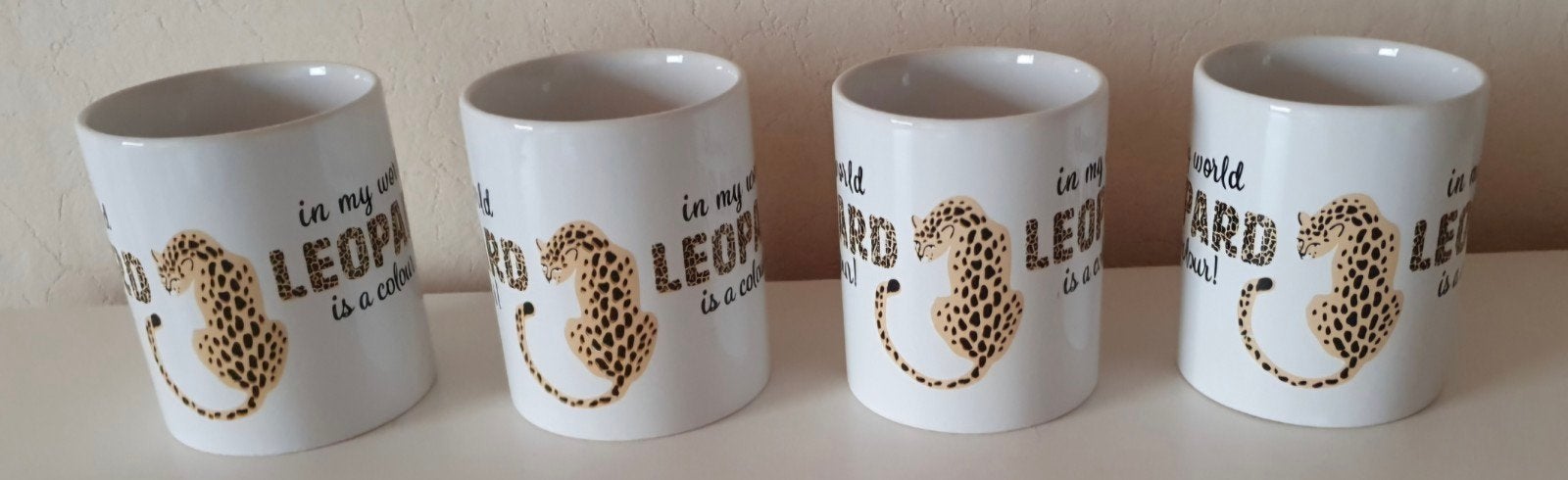 4 bekers / in my world leopard is a colour!, Ophalen of Verzenden, Zo goed als nieuw, Aardewerk
