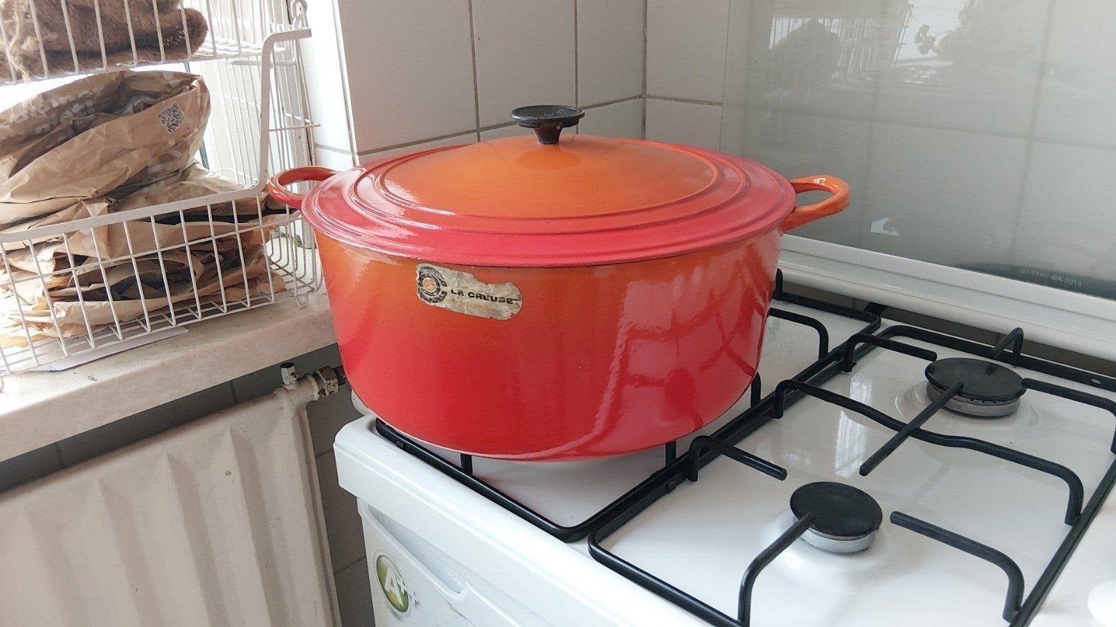 Le Creuset geëmailleerde gietijzeren braadpan - Oranje, Huis en Inrichting, Keuken | Potten en Pannen, Gebruikt, Ophalen of Verzenden