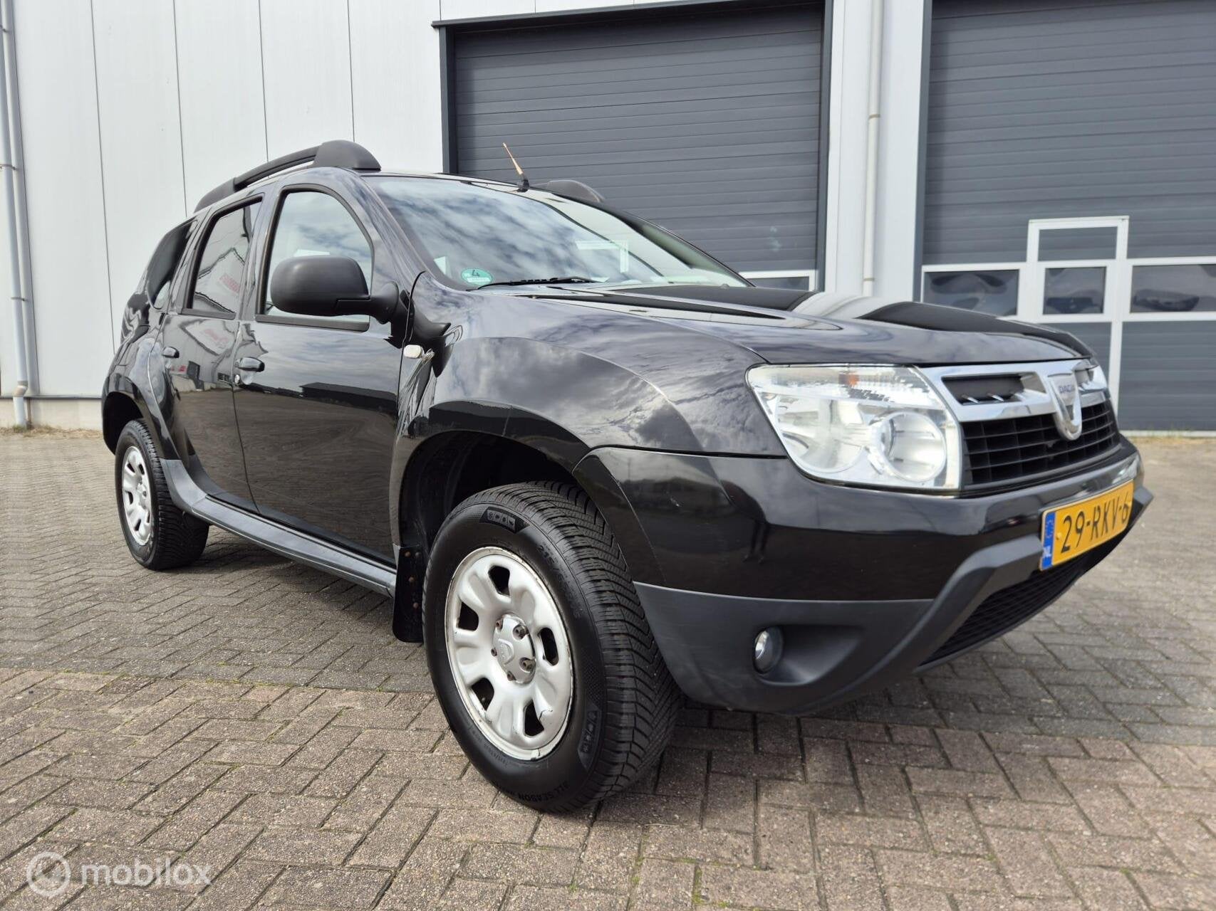 Dacia Duster 1.6 Lauréate 2wd | Airco | Trekhaak, Auto's, Voorwielaandrijving, Euro 5, Gebruikt, 4 cilinders