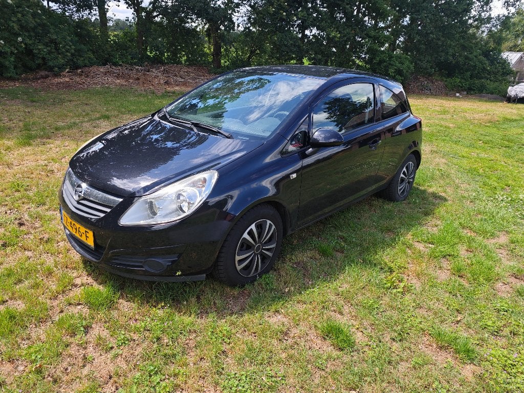Opel Corsa 1.2 16V 3D 2010 Zwart [AIRCO DEFECT!], Auto's, Opel, Voorwielaandrijving, 40 €/maand, Zwart, 1229 cc