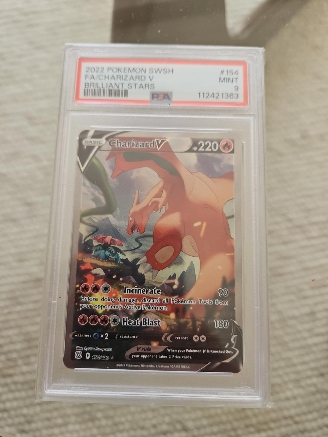 Charizard V Alternate Art – PSA 9 – Brilliant Stars 2022, Ophalen, Zo goed als nieuw