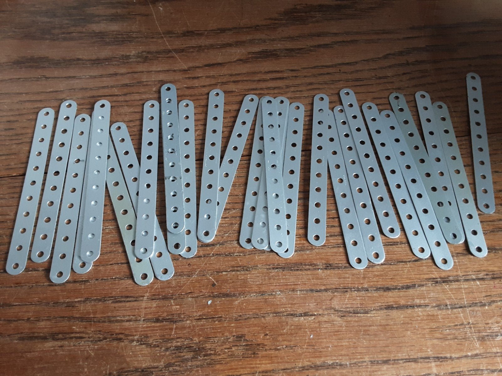 Meccano onderdelen - 60 strips, 11gaats, alluminiumkleurig,, Ophalen of Verzenden, Gebruikt