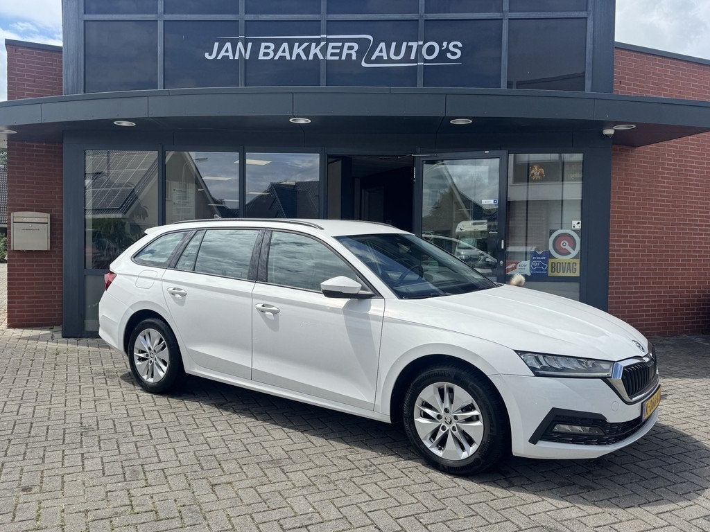 Skoda Octavia Combi 1.0 e-TSI Business Edition ✅ Automaat, Auto's, 12 maanden, Stof, Gebruikt, Hybride Elektrisch/Benzine