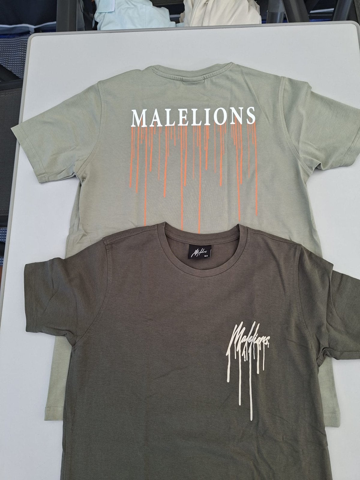 2 Malelions shirts maat 164, Ophalen of Verzenden, Zo goed als nieuw, Jongen, Shirt of Longsleeve