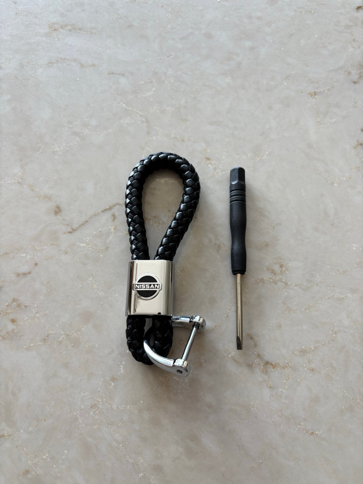 Zwarte gevlochten Nissan sleutelhanger met schroevendraaier, Verzamelen, Sleutelhangers, Ophalen of Verzenden, Nieuw, Merk