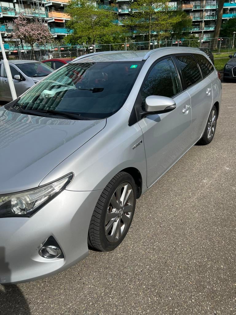 Toyota Auris 1.8 Hybrid Touring Sports CVT 2015 Grijs, Auto's, Zwart, 25 km/l, Auris, 1320 kg