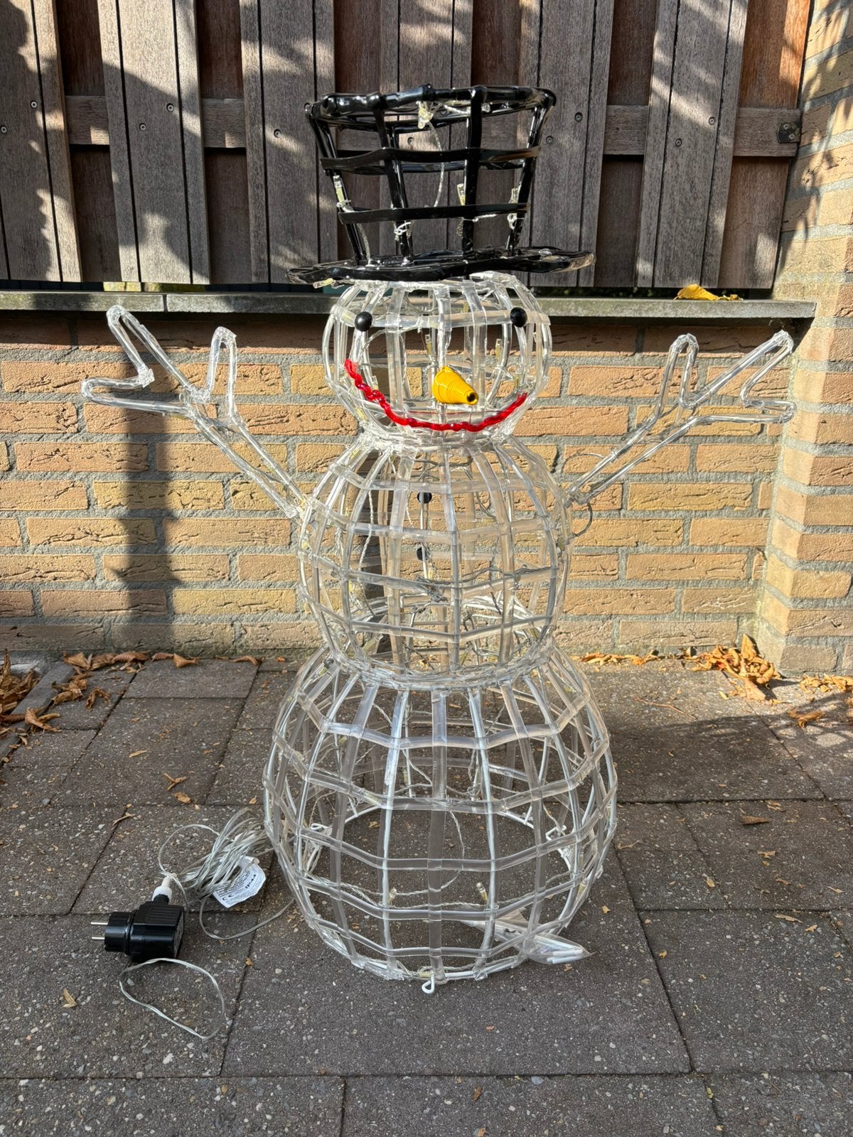 Sneeuwpop met verlichting, Ophalen