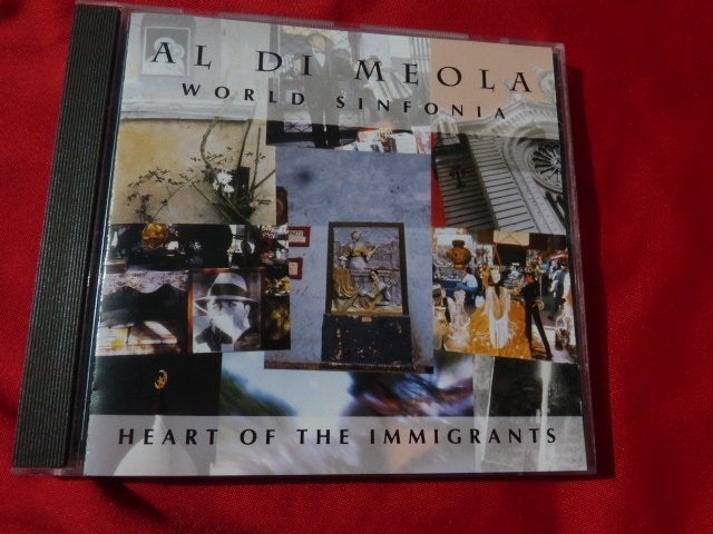 AL DI MEOLA - CD WORLD SINFONIA /HEARTS OF THE IMMIGRANTS, Cd's en Dvd's, Cd's | Jazz en Blues, Ophalen of Verzenden, Jazz