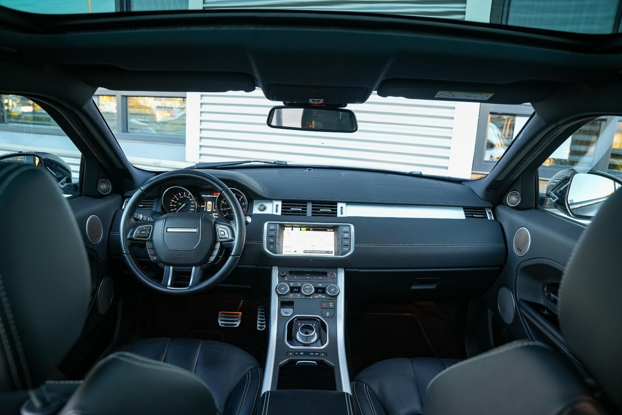 Land Rover Range Rover Evoque 2.0 Si 4WD Prestige Dynamic St, Auto's, Euro 5, 4 cilinders, Zwart, Leder