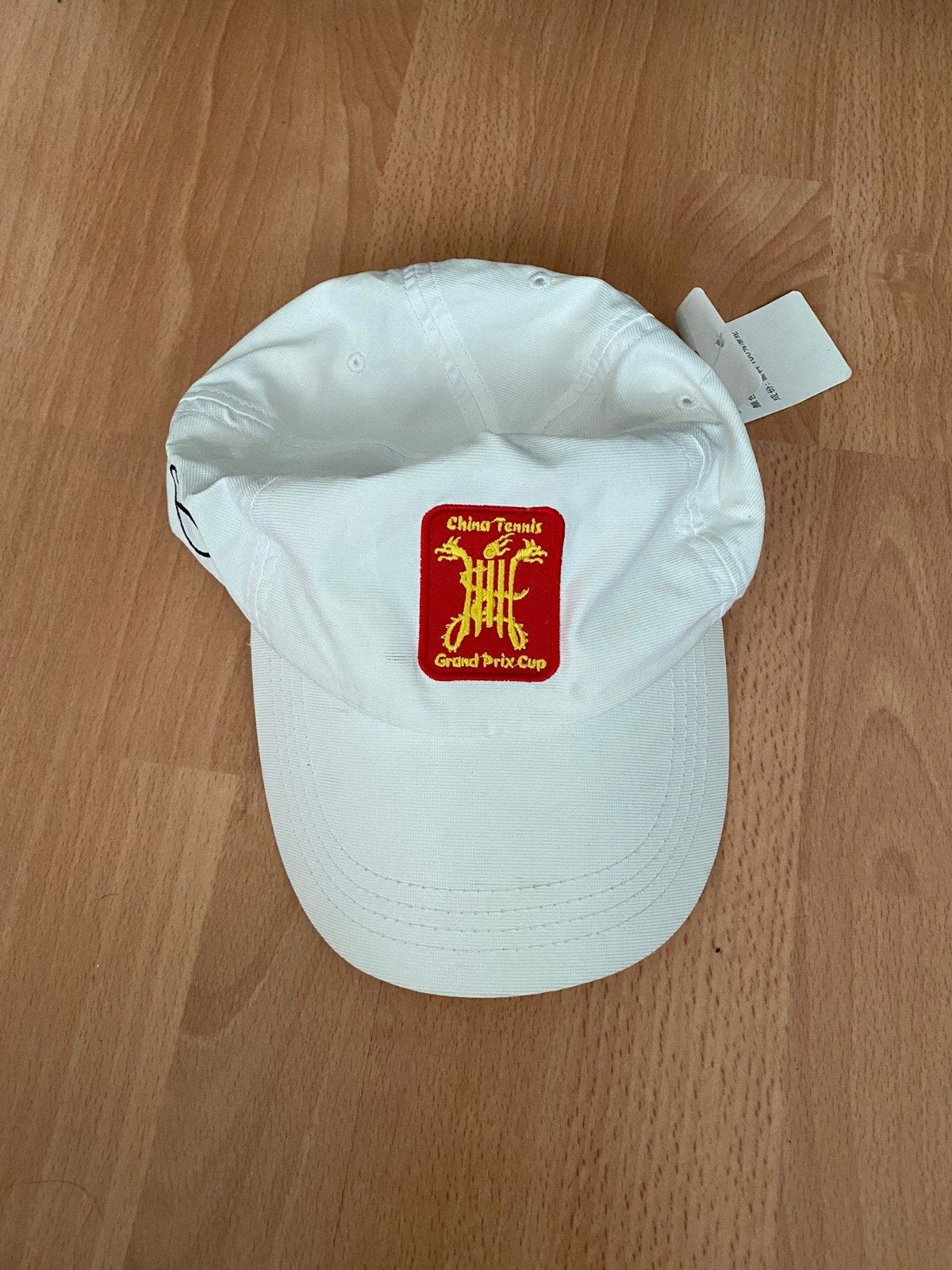 Witte Anta pet met China Tennis Grand Prix Cup logo, Nieuw, Pet, Anta, One size fits all