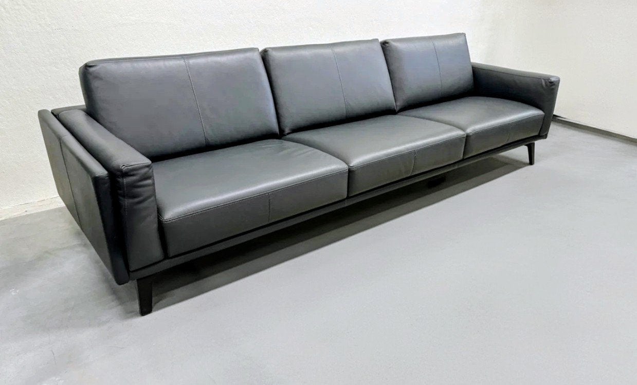 Leolux Bellice design bank + poef in zwart senso leder, Ophalen of Verzenden, Zo goed als nieuw, 75 tot 100 cm
