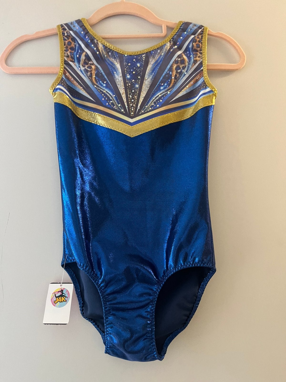 Nieuw turnpakje maar 140 - blauw goud panter glitters, Kindermaat 122 t/m 140, Ophalen of Verzenden, Nieuw, Turnpak(je)