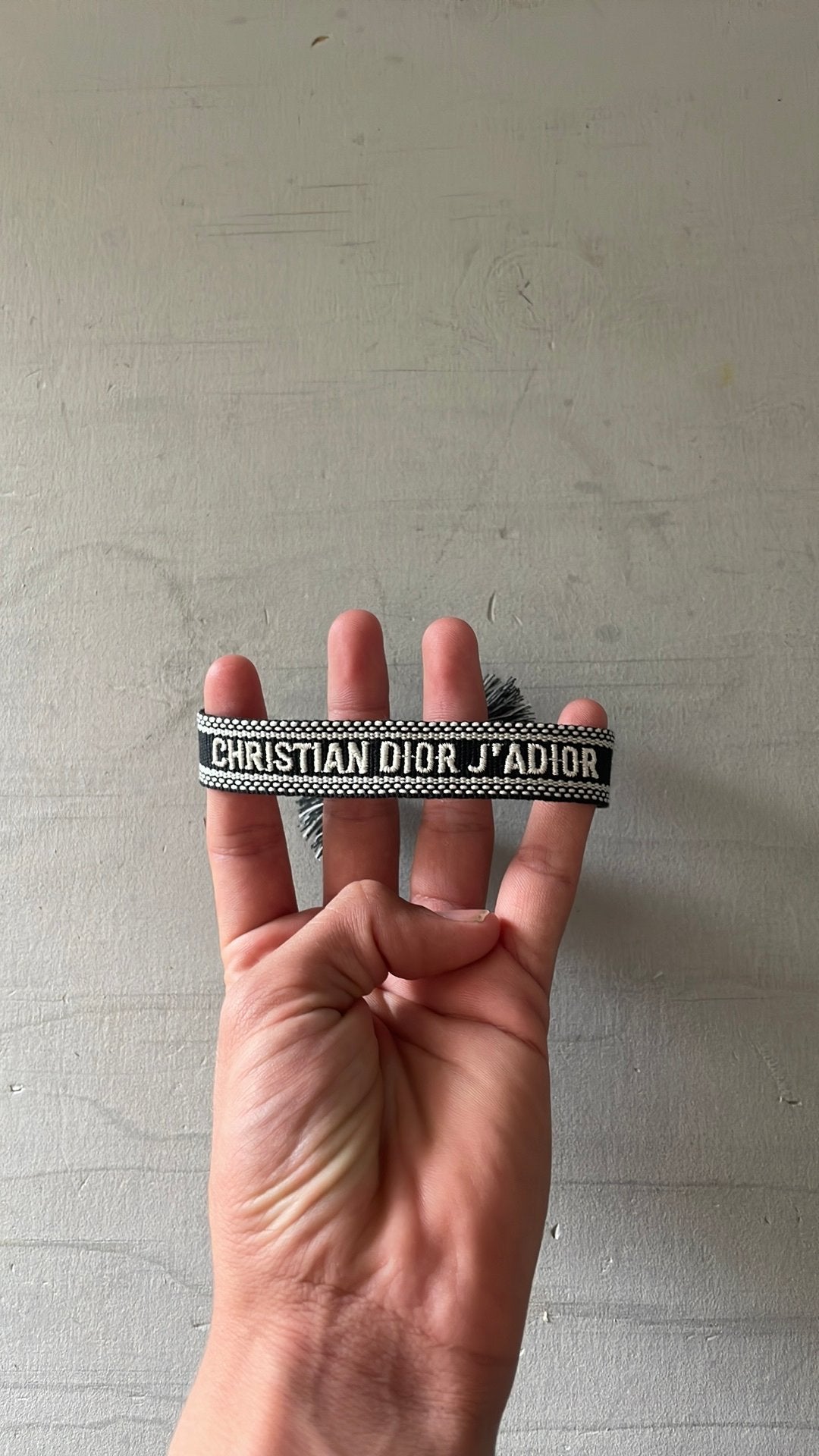 Christian Dior armbandje, Ophalen of Verzenden, Zo goed als nieuw, Zwart, Overige materialen