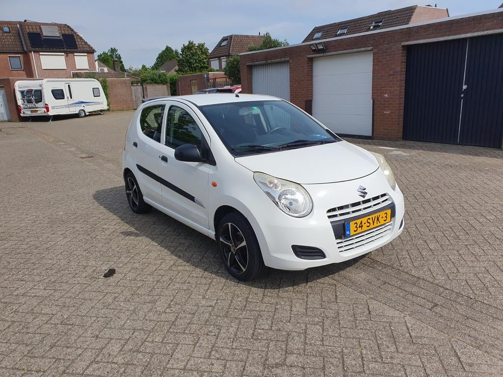 Suzuki Alto 1.0 2011 Wit, Auto's, Voorwielaandrijving, Stof, 4 stoelen, Origineel Nederlands