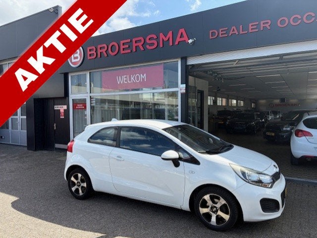 Kia Rio 1.2 CVVT Comfort Pack NIEUWE APK * (bj 2013), Auto's, Kia, Euro 5, 4 cilinders, Elektrische ramen, Wit
