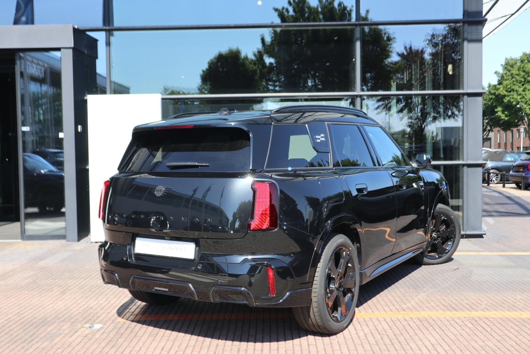 MINI Countryman C | John Cooper Works uitvoering + Pakket L, Gebruikt, Met garantie (alle), Leder en Stof, Zwart