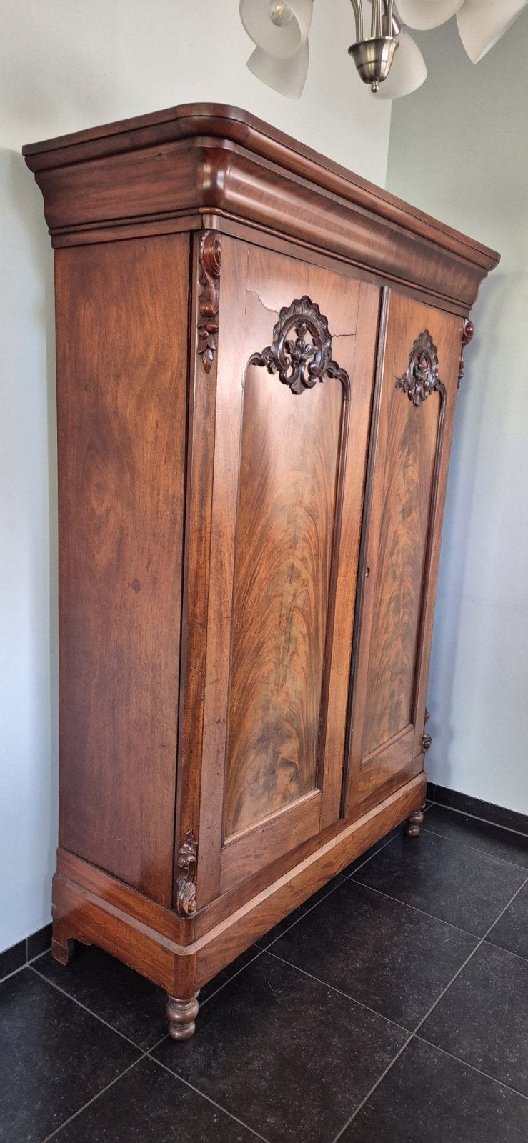 Antieke mahoniehouten kast, Ophalen