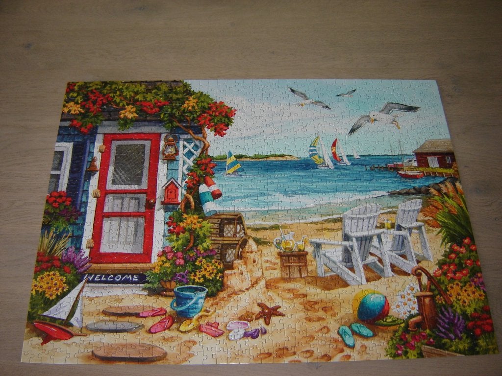 Puzzel SunsOut BEACH SUMMER COTTAGE 1000 st., Hobby en Vrije tijd, Ophalen of Verzenden, 500 t/m 1500 stukjes, Zo goed als nieuw
