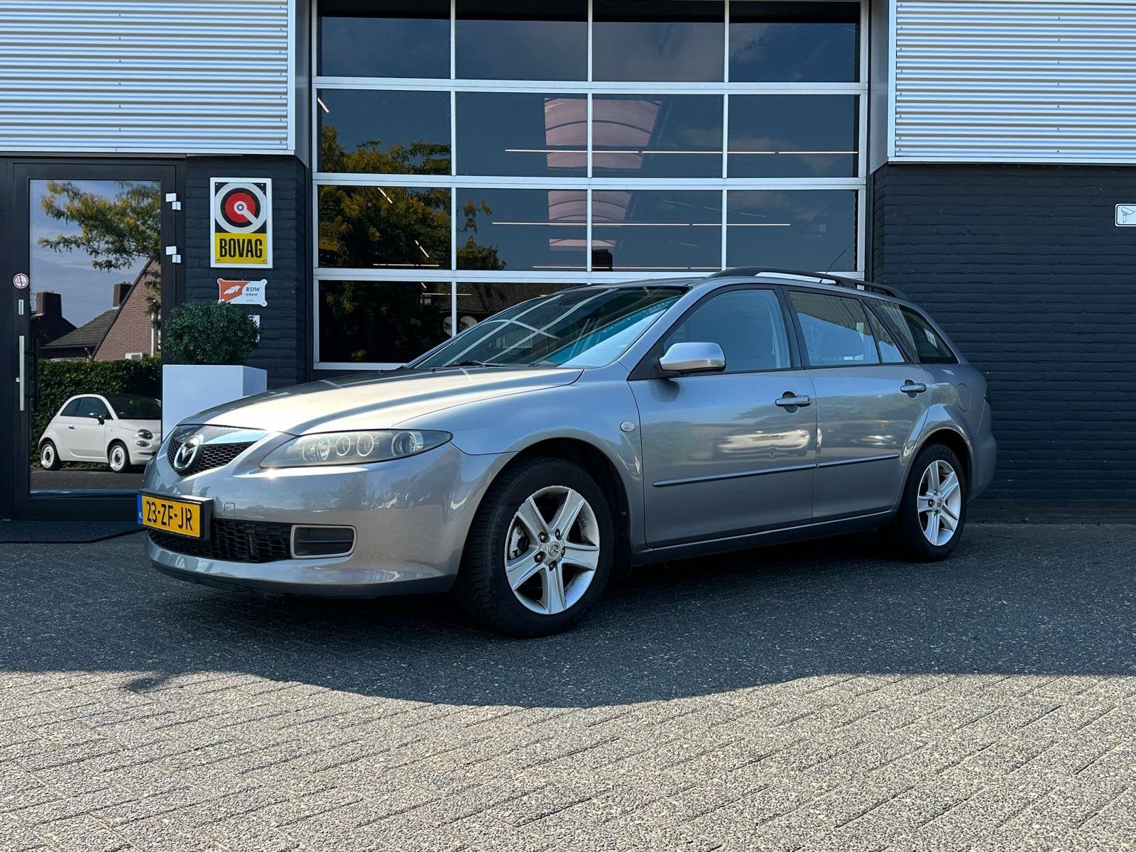 Mazda 6 Sportbreak 1.8i Touring, Airco, Radio, Trekhaak, NAP, Stof, Gebruikt, Zwart, 4 cilinders
