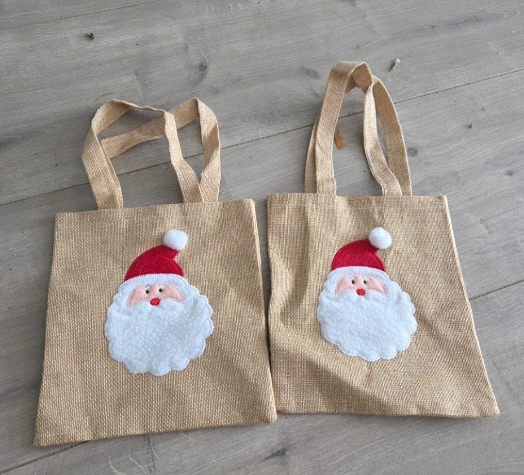 2 zakjes tasjes met de kerstman er op, Ophalen of Verzenden, Zo goed als nieuw