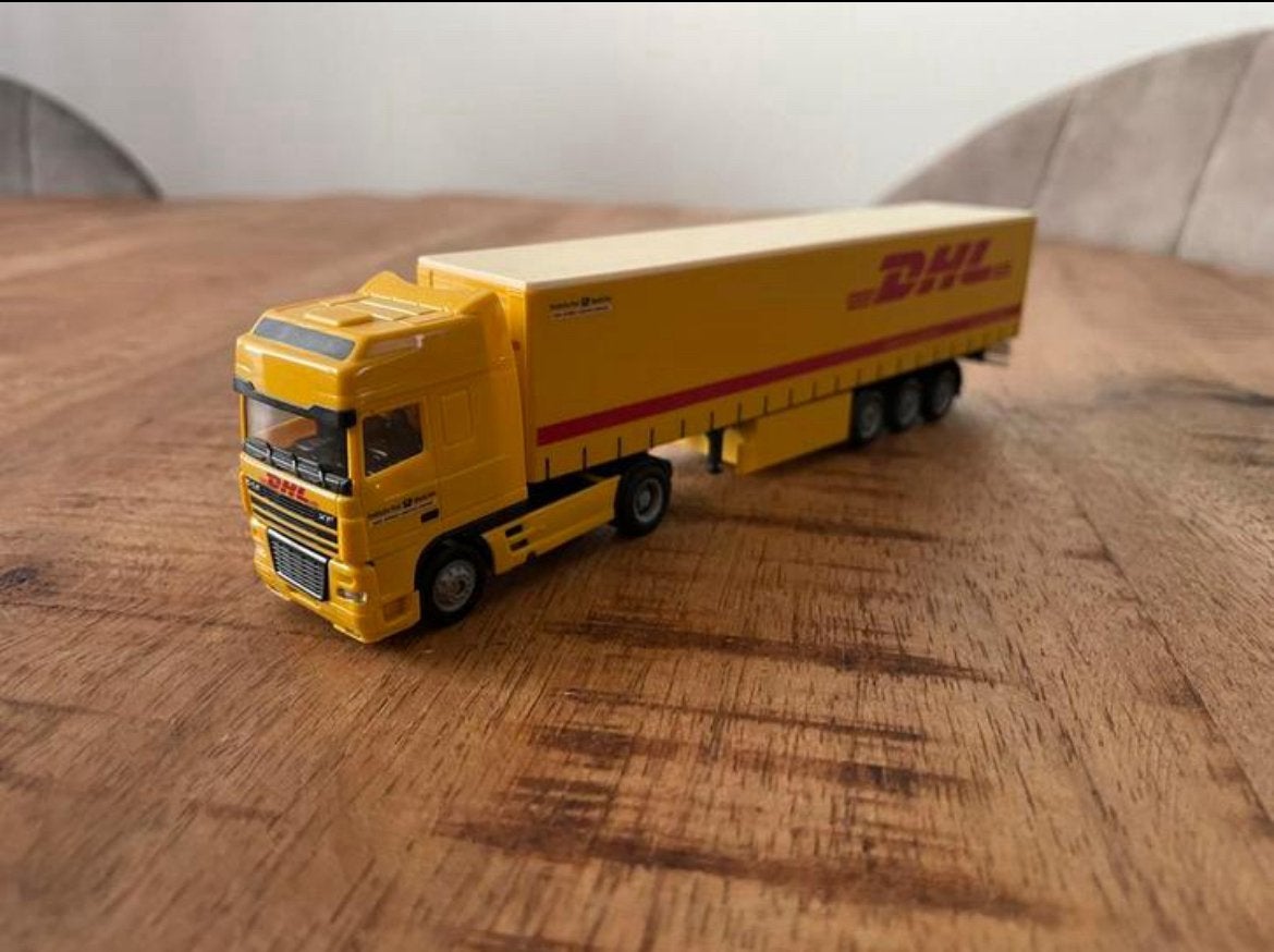 Herpa Daf 95 XF DP met dhl tautliner, Hobby en Vrije tijd, Modelauto's | 1:87, Ophalen of Verzenden, Zo goed als nieuw, Bus of Vrachtwagen